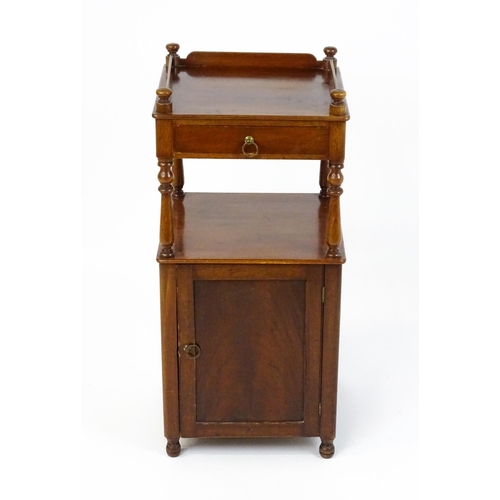 1510 - A late 19thC mahogany bedside cabinet with turned uprights, a single short drawer and a panelled cup... 