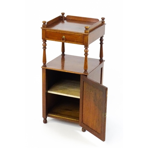 1510 - A late 19thC mahogany bedside cabinet with turned uprights, a single short drawer and a panelled cup... 