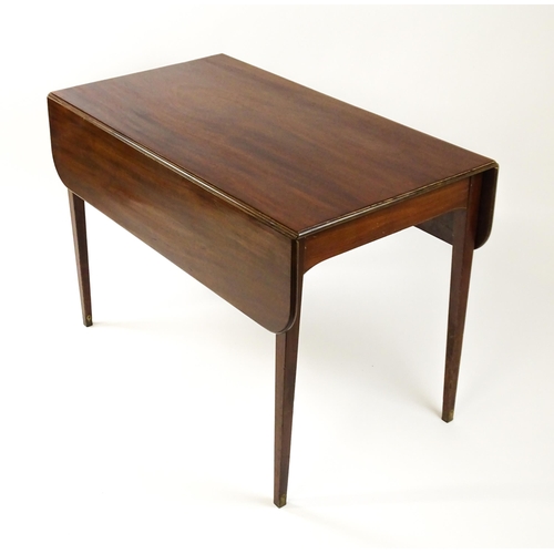 1523 - A 19thC mahogany drop flap table raised on four straight tapering legs. 23