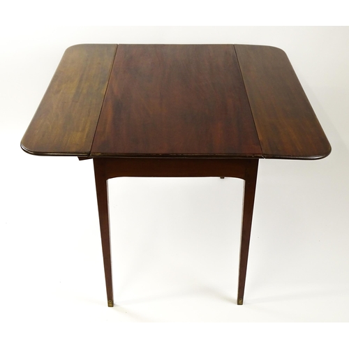 1523 - A 19thC mahogany drop flap table raised on four straight tapering legs. 23