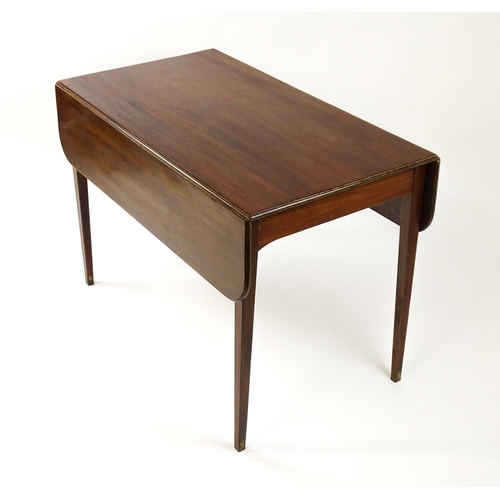 1523 - A 19thC mahogany drop flap table raised on four straight tapering legs. 23