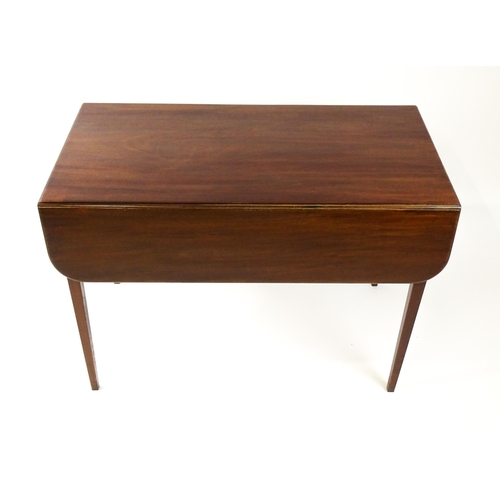 1523 - A 19thC mahogany drop flap table raised on four straight tapering legs. 23