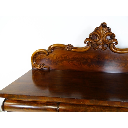 1528 - A 19thC mahogany sideboard with a carved, shaped upstand above three short drawers, the  pedestal ba... 