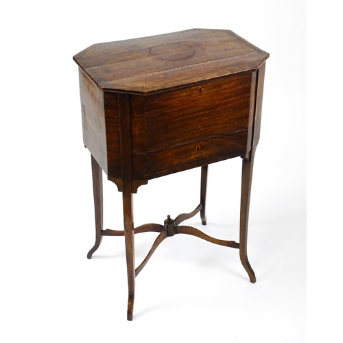 1532 - An early / mid 19thC mahogany sewing table with a crossbanded, hinged lid above a single short drawe... 