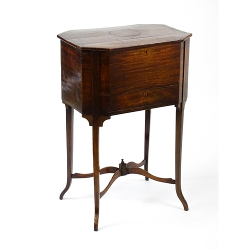 1532 - An early / mid 19thC mahogany sewing table with a crossbanded, hinged lid above a single short drawe... 