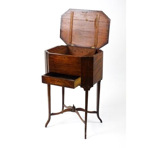 1532 - An early / mid 19thC mahogany sewing table with a crossbanded, hinged lid above a single short drawe... 