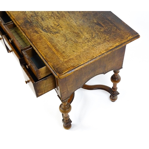 1536 - A late 17thC / early 18thC walnut lowboy with a crossbanded top above six small drawers raised on tu... 