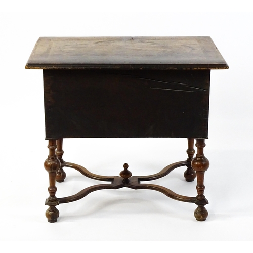 1536 - A late 17thC / early 18thC walnut lowboy with a crossbanded top above six small drawers raised on tu... 