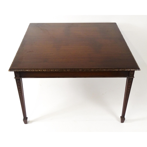 1538 - An early 20thC mahogany Waring and Gillows dining table comprised of two demi lune end tables and a ... 