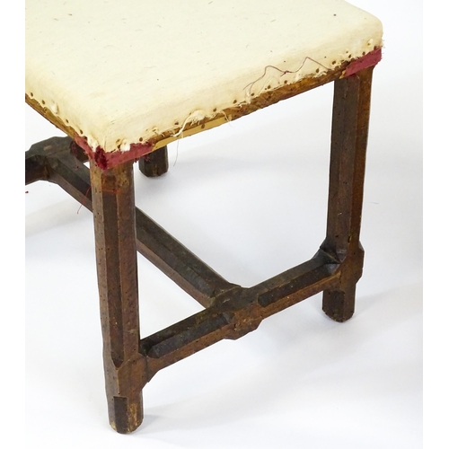 1543 - A pair of Georgian walnut stools raised on chamfered legs and supported by chamfered stretchers. 21