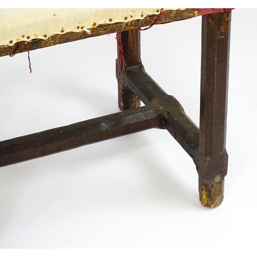 1543 - A pair of Georgian walnut stools raised on chamfered legs and supported by chamfered stretchers. 21