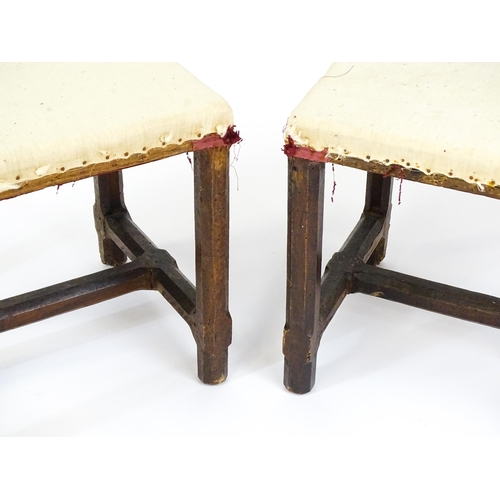 1543 - A pair of Georgian walnut stools raised on chamfered legs and supported by chamfered stretchers. 21