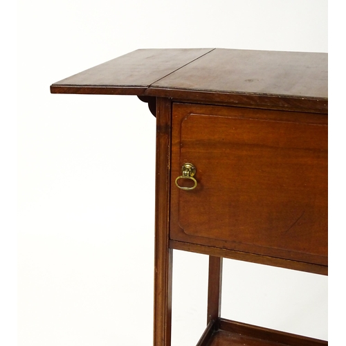 1547 - A late 19thC / early 20thC mahogany bedside cabinet / pot cupboard with two drop leaves above a sing... 