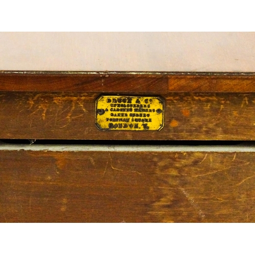 1547 - A late 19thC / early 20thC mahogany bedside cabinet / pot cupboard with two drop leaves above a sing... 