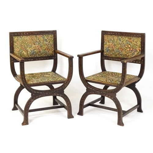 1563 - A pair of late 19thC / early 20thC x-frame armchairs with William Morris upholstery. 23