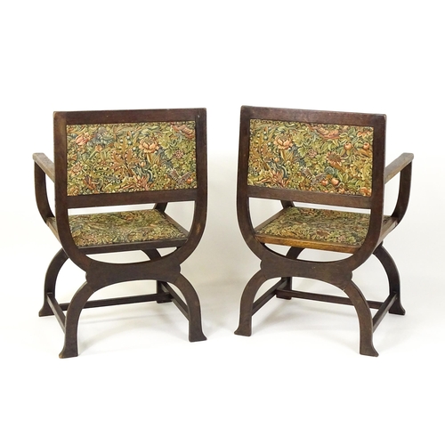 1563 - A pair of late 19thC / early 20thC x-frame armchairs with William Morris upholstery. 23