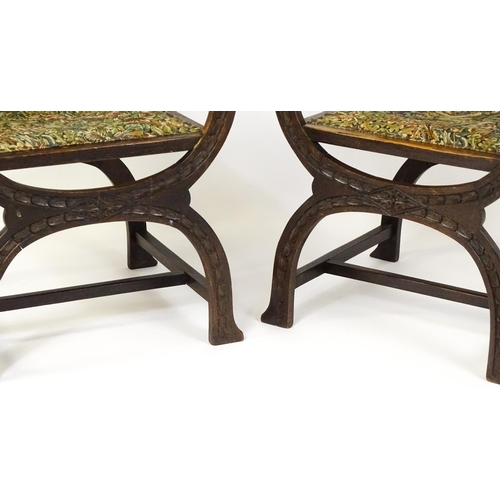 1563 - A pair of late 19thC / early 20thC x-frame armchairs with William Morris upholstery. 23