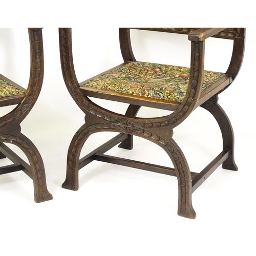 1563 - A pair of late 19thC / early 20thC x-frame armchairs with William Morris upholstery. 23