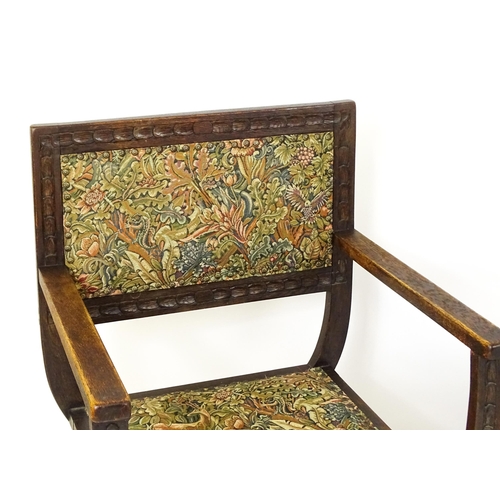 1563 - A pair of late 19thC / early 20thC x-frame armchairs with William Morris upholstery. 23