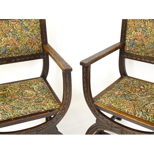 1563 - A pair of late 19thC / early 20thC x-frame armchairs with William Morris upholstery. 23