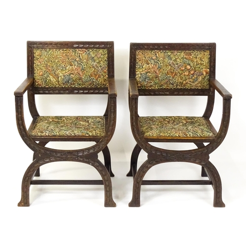 1563 - A pair of late 19thC / early 20thC x-frame armchairs with William Morris upholstery. 23