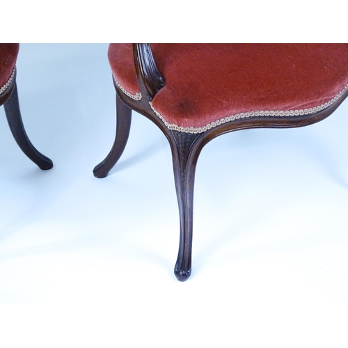 1567 - A pair of 19thC fauteuil armchairs with a carved cresting rail and arms raised on shaped seat rails ... 