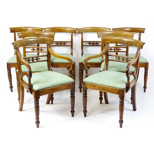 1575 - A set of eight late 19thC / early 20thC mahogany dining chairs with bowed backrests above carved mid... 