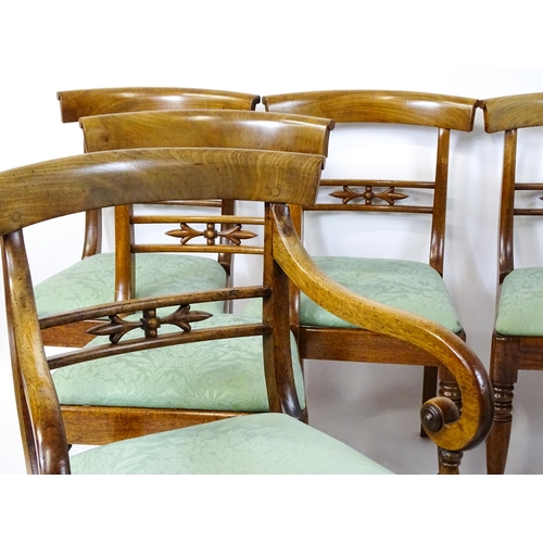 1575 - A set of eight late 19thC / early 20thC mahogany dining chairs with bowed backrests above carved mid... 