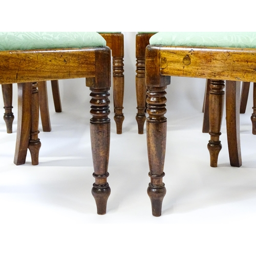 1575 - A set of eight late 19thC / early 20thC mahogany dining chairs with bowed backrests above carved mid... 