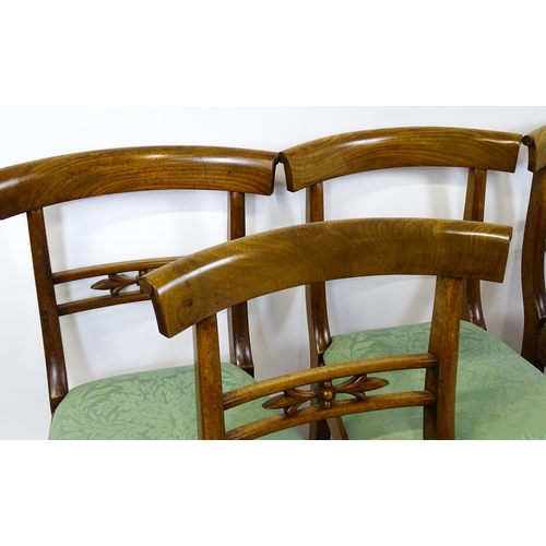 1575 - A set of eight late 19thC / early 20thC mahogany dining chairs with bowed backrests above carved mid... 