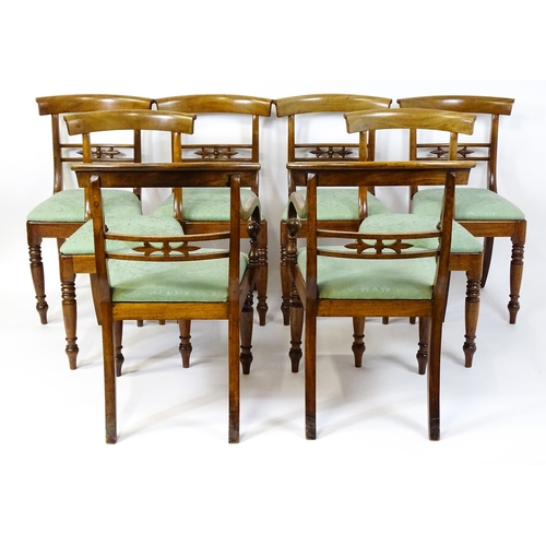 1575 - A set of eight late 19thC / early 20thC mahogany dining chairs with bowed backrests above carved mid... 