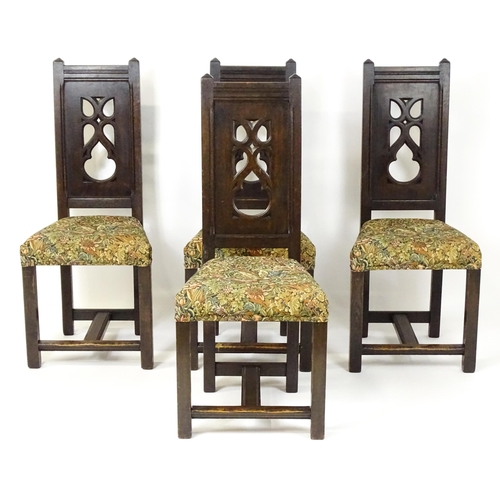 1580 - A set of four late 19thC Gothic revival chairs, having pierced back splits. Morris upholstery and ra... 