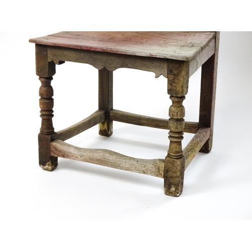 1605 - A medieval revival side chair with a carved panelled backrest, above turned tapering front legs and ... 