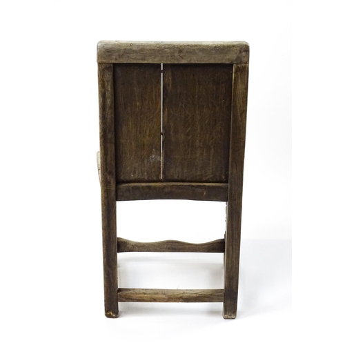 1605 - A medieval revival side chair with a carved panelled backrest, above turned tapering front legs and ... 