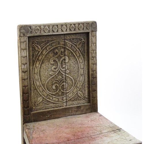 1605 - A medieval revival side chair with a carved panelled backrest, above turned tapering front legs and ... 