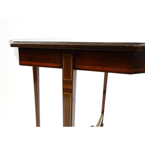 1609 - An Edwardian mahogany occasional table with an octagonal top above four tapering legs terminating in... 