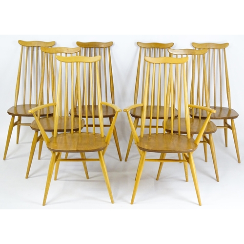 1632 - Vintage / Retro: A set of eight Ercol 'Goldsmith' Windsor dining chairs, with comb backs and shaped ... 