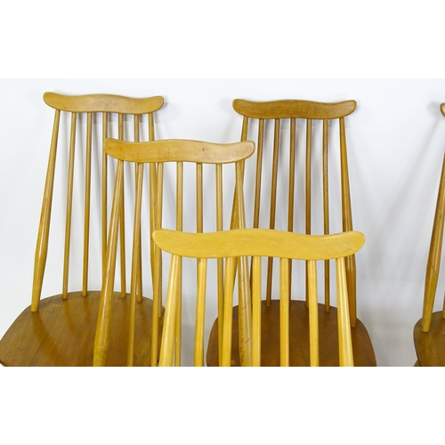 1632 - Vintage / Retro: A set of eight Ercol 'Goldsmith' Windsor dining chairs, with comb backs and shaped ... 