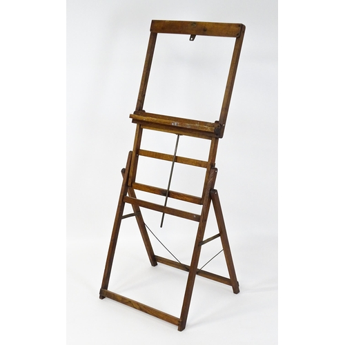 1639 - An early 20thC oak Clifford Milburn adjustable easel. Bearing plaque. 'Clifford Milburn, Commercial ... 