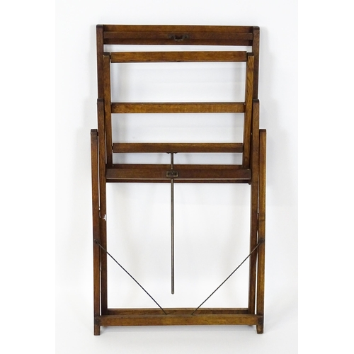 1639 - An early 20thC oak Clifford Milburn adjustable easel. Bearing plaque. 'Clifford Milburn, Commercial ... 