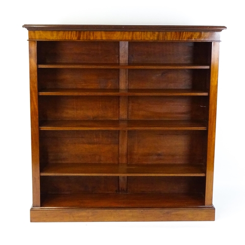 1470 - A late 19thC mahogany bookcase with a moulded cornice above four adjustable shelves. 56