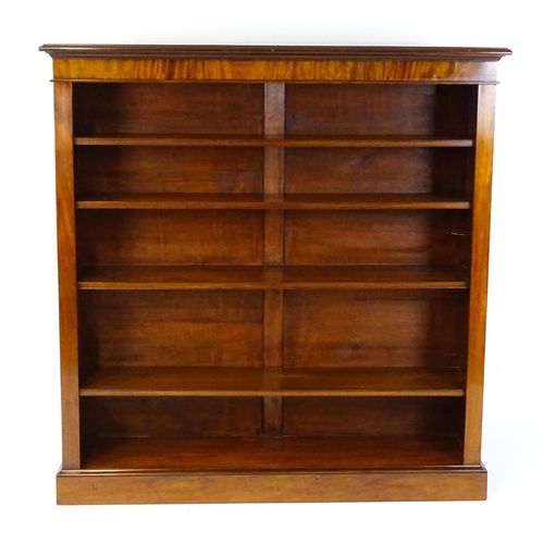 1470 - A late 19thC mahogany bookcase with a moulded cornice above four adjustable shelves. 56