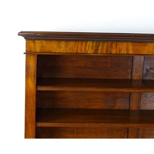 1470 - A late 19thC mahogany bookcase with a moulded cornice above four adjustable shelves. 56