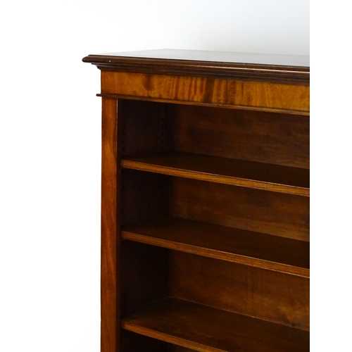 1470 - A late 19thC mahogany bookcase with a moulded cornice above four adjustable shelves. 56