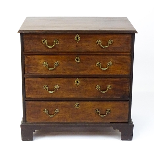 1484 - A late 18thC mahogany bachelors chest of drawers, the chest of drawers comprising four long drawers ... 