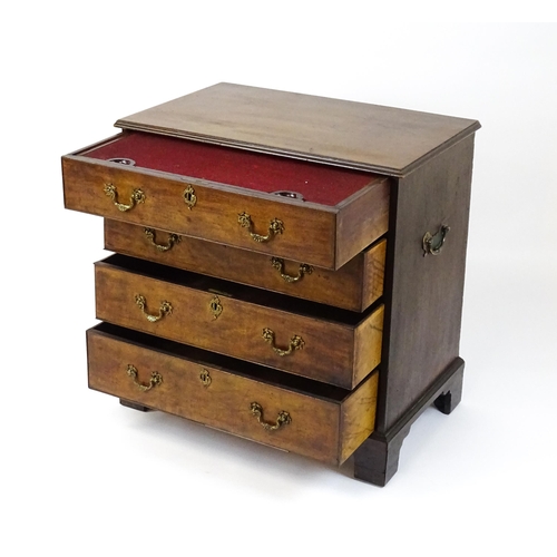 1484 - A late 18thC mahogany bachelors chest of drawers, the chest of drawers comprising four long drawers ... 