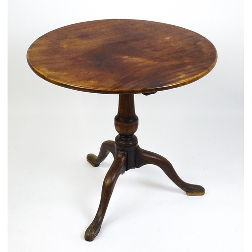 1518 - A late 18thC tripod table with a mahogany top above a turned oak pedestal and three cabriole legs. 2... 