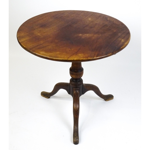 1518 - A late 18thC tripod table with a mahogany top above a turned oak pedestal and three cabriole legs. 2... 