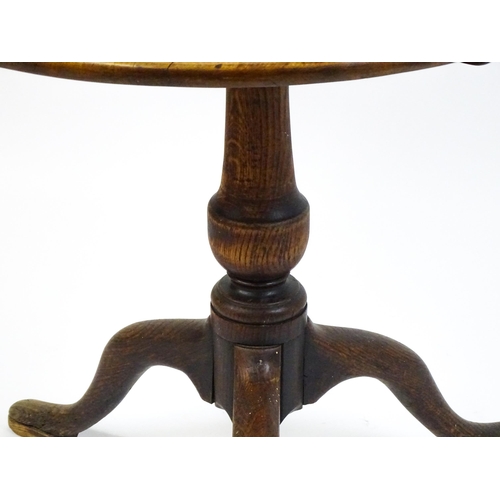 1518 - A late 18thC tripod table with a mahogany top above a turned oak pedestal and three cabriole legs. 2... 