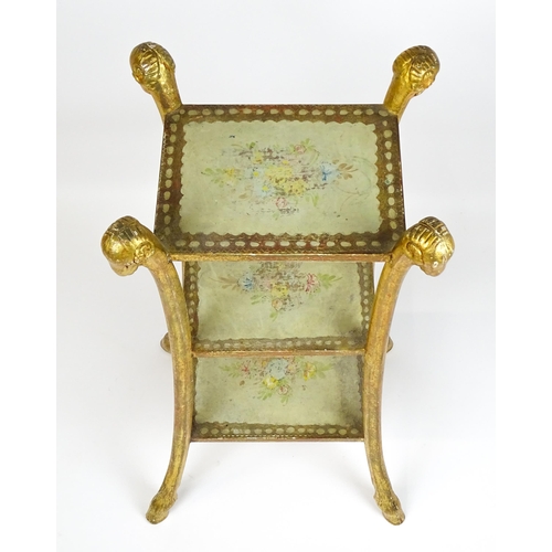 1530 - A William Kent style etagere with three tiers raised on splayed supports with rams head terminals an... 